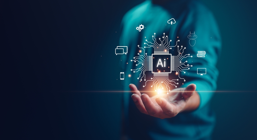 Hand holding floating circuit board with "AI" in center and phone, cloud, chat, etc icons