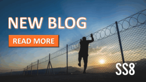SS8 New Blog, Read More. Image of man climbing a fence with barbed wire