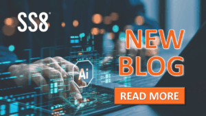 A hand typing on a laptop and table at the same time and a holographic "AI" icon floating above, with the SS8 logo and text "New Blog. Read More"