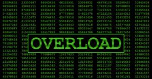 A computer screen with hundreds of lines of code and the word "Overload".