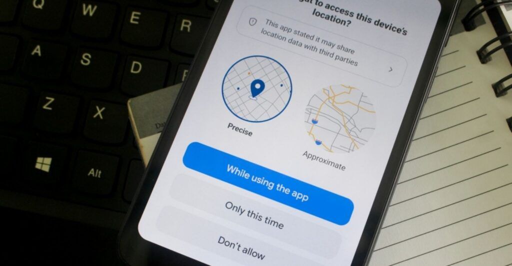 A phone showing an app asking permission to share precise or approximate location data.