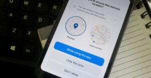 A phone showing an app asking permission to share precise or approximate location data.