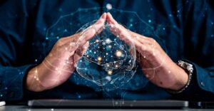 Un globe numérique contenant une icône représentant un cerveau et sur lequel apparaissent des connexions réseau, le tout projeté au-dessus d'une tablette